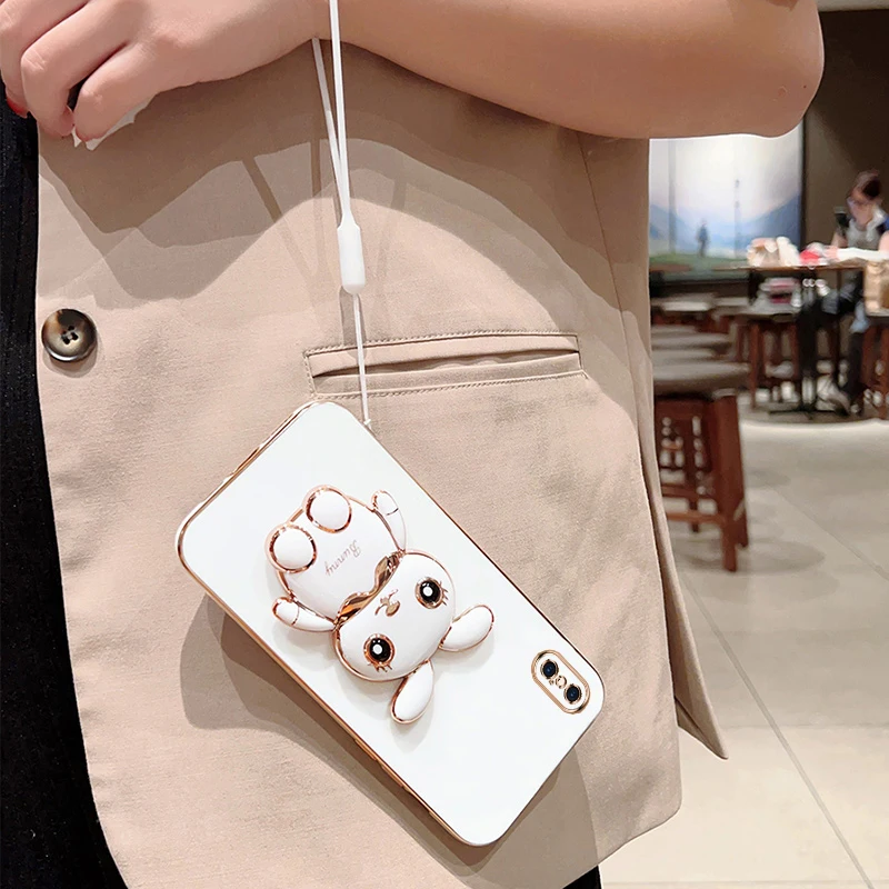 Калъф за Iphone XS Max с хубав анимационни заек, сгъваема поставка с каишка, мека силиконова капачка с луксозен покритие